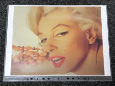 Bert Stern - A signed print on photographic paper - Marilyn with the beads. 30 cm x 42 cm.