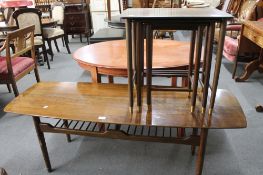 A mid century coffee table with under stretcher and a nest of tables.