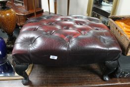 A Burgundy red leather footstool