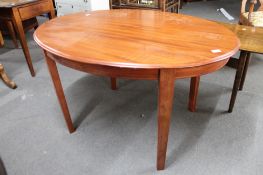 A reproduction oval occasional table.
