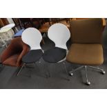 A mid century swivel office chair, pair white chairs and one further low chair.