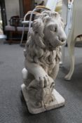 A painted concrete figure of a lion.