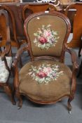 A 19th century mahogany armchair in tapestry fabric.