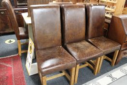 A set of eight brown leather contemporary dining chairs