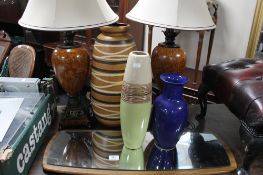 A pair of table lamps and a West German pottery vase,