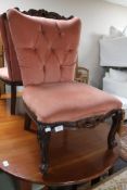 A pair of pink buttoned dralon carved chairs