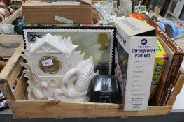 A crate of ceramic figured mantel clock, puzzle, pan set,