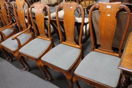 Eight classical style early 20th century oak dining chairs.