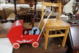 A child's pull along cart together with small stool