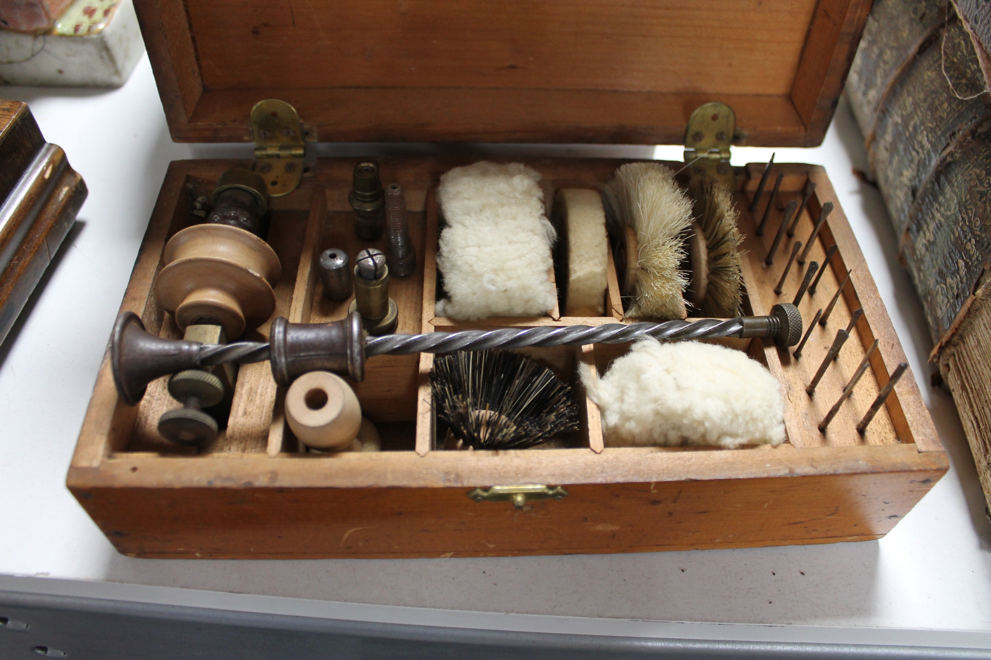 A vintage boxed watchmaker's cleaning kit