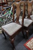 A set of four Queen Ann style mahogany dining chairs