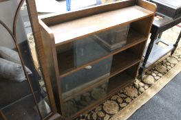 A mid century sliding glass door bookcase