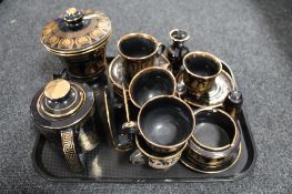 A tray of 24kt gold plated Grecian style china