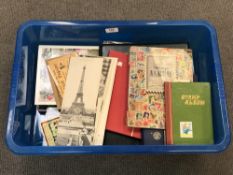 A box of various loose postcards and postcard albums,