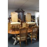 A reproduction twin pedestal dining table and bergere backed chairs CONDITION REPORT: