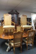 A reproduction twin pedestal dining table and bergere backed chairs CONDITION REPORT: