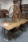 An Ercol dining table and six chairs