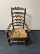 A nineteenth century oak country ladder backed chair