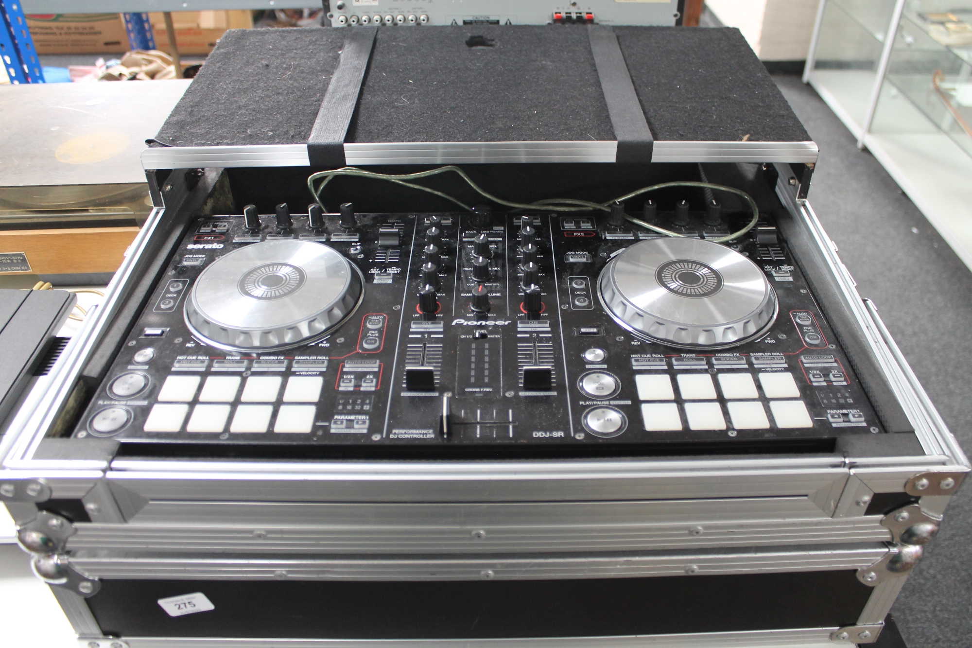 A Pioneer DDJ-SR Serato DJ controller together with Magma flight case