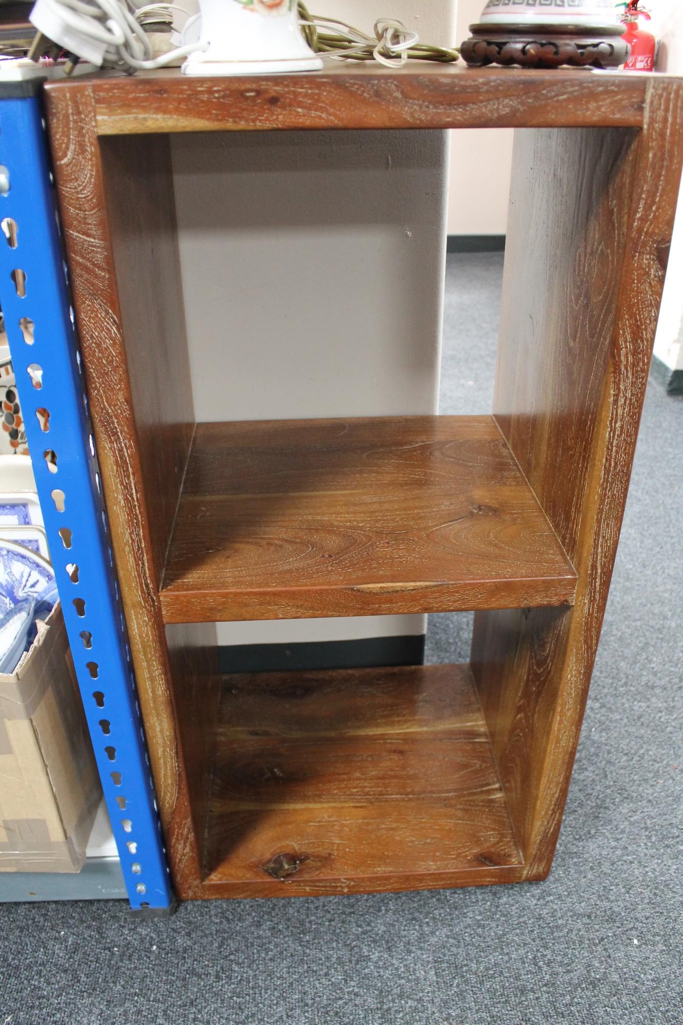 A hardwood book stand, height 92 cm, 48 cm width and 40.5 cm depth.