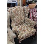 A reproduction armchair in floral covering