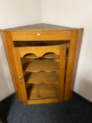 A nineteenth century pine corner cabinet