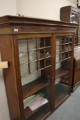 A Victorian mahogany double door glazed bookcase, width 146 cm.