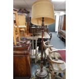 An antique oak standard lamp with shade,