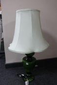 A green glass table lamp together with an oak barometer