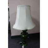 A green glass table lamp together with an oak barometer