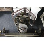 An Edwardian brass mirrored fire screen together with two brass curbs, brass rail, inlaid screen,