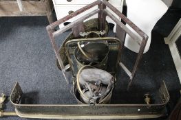 An Edwardian brass mirrored fire screen together with two brass curbs, brass rail, inlaid screen,