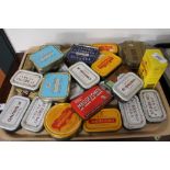 A quantity of metal advertising tins