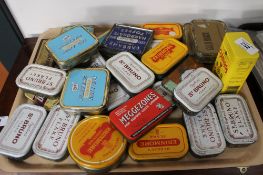 A quantity of metal advertising tins