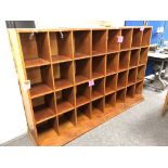 A wooden haberdashery shop display cabinet with 32 compartments, height 132 cm, depth 51.