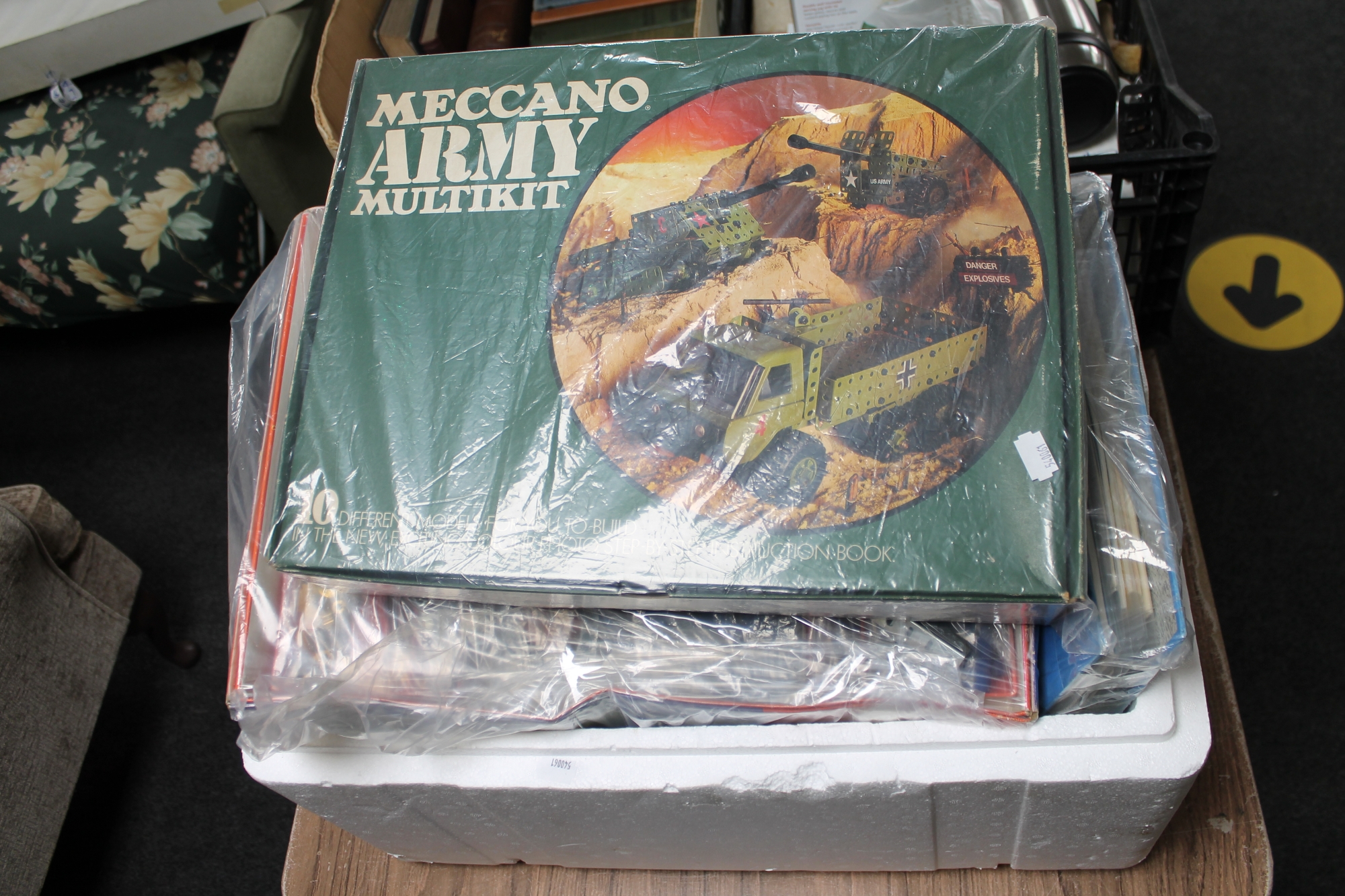 A box of Meccano and manuals