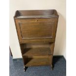 A painted white chest of drawers.