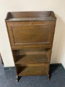 A painted white chest of drawers.