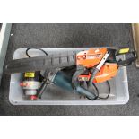 A petrol chainsaw together with a Bosch grinder etc