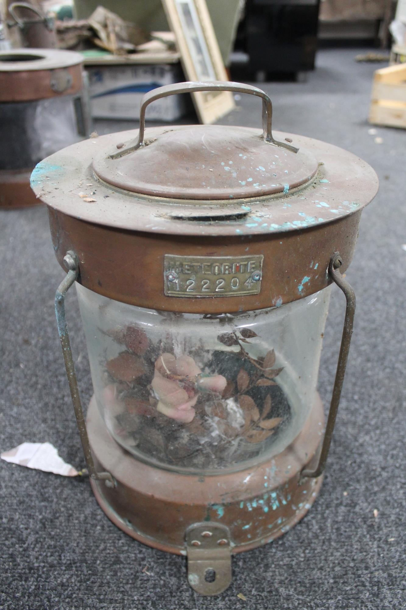 A copper ship's lamp