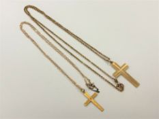 Two 9ct gold crucifix pendants on chains, 9.2g CONDITION REPORT: 9.2g gross.