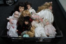 A tray of porcelain headed dolls