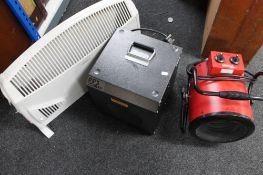 A portable electric heater together with a further metal heater and radiator