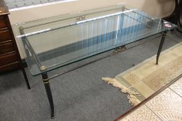 A glass topped metal coffee table