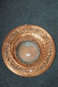 A copper charger together with a copper bowl