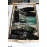 A tray of antique and later glass bottles