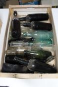 A tray of antique and later glass bottles