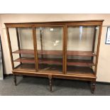 A Victorian mahogany glazed triple door cabinet, width 219 cm, height 172 cm, depth 52 cm.