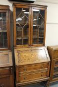 An Edwardian oak bureau bookcase CONDITION REPORT: 192cm high by 77cm wide by 46cm