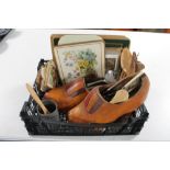 A crate of wooden clogs,